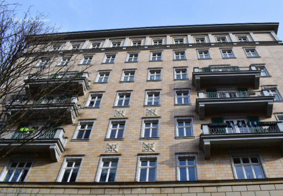 East Berlin residential block featuring repetitive window patterns and balconies from the postwar era