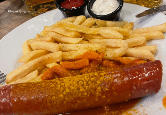 Currywurst with fries served at Beer Pub München in Berlin, with curry ketchup