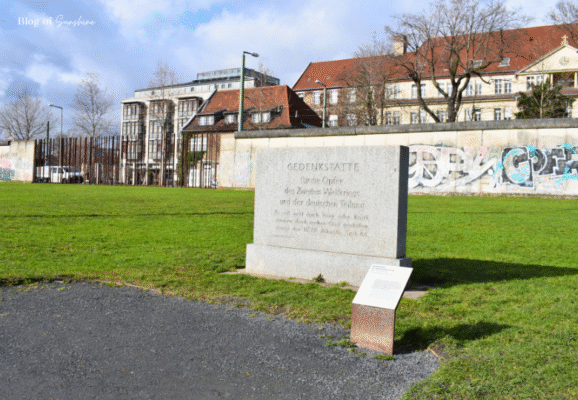 Memorial stone honoring victims of World War II and the Berlin Wall at the Berlin Wall Memorial park