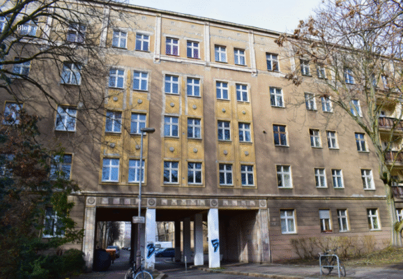 Example of socialist-era residential architecture in East Berlin with symmetrical windows and concrete facade