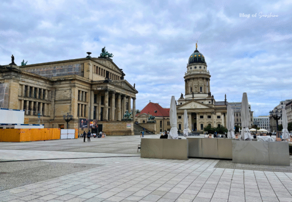 View across Gendarmenmarkt square featuring Konzerthaus Berlin on the left and the German Cathedral on the right