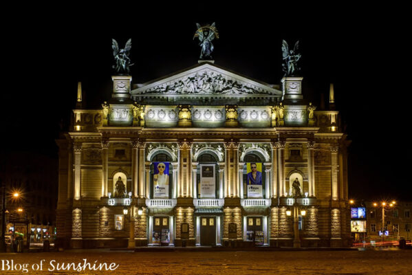 Lviv National Opera House beautifully illuminated at night, showcasing its ornate neo-Renaissance and Baroque architectural details