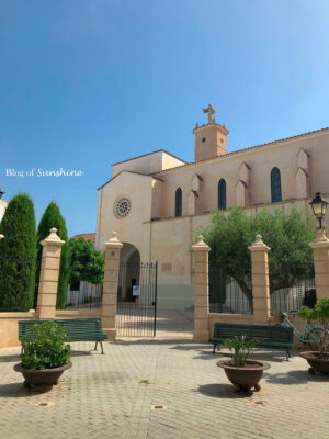 Monasterio de Santa Clara in Ciutadella, Menorca with courtyard benches and traditional sandstone architecture