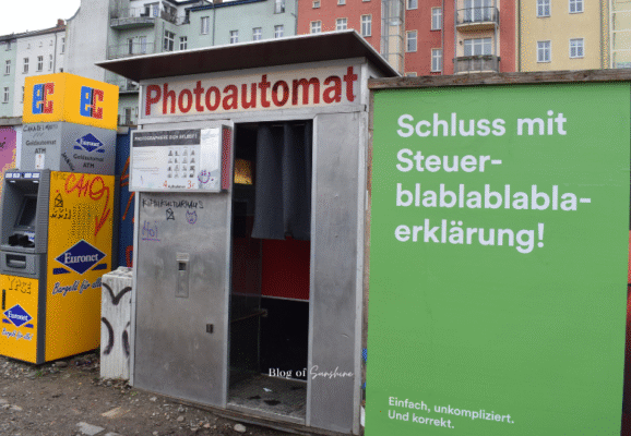 Exterior view of a vintage Photoautomat booth in Berlin, known for producing black-and-white analog photo strips