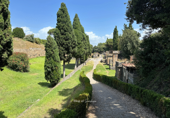 Tree-lined funerary street in Pompeii with Roman tombs along the Via delle Tombe near Porta Ercolano