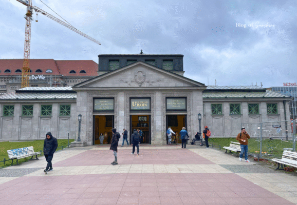 Historic entrance to Wittenbergplatz U-Bahn station in Berlin with classical architecture and surrounding pedestrians