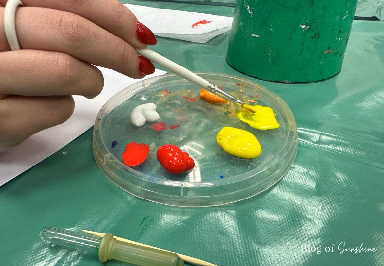 Painting setup with brush and acrylic paint palette at Cliffe Castle craft room
