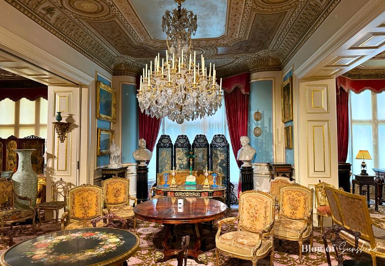 Antique furniture and ornate ceiling in the drawing room at Cliffe Castle Keighley