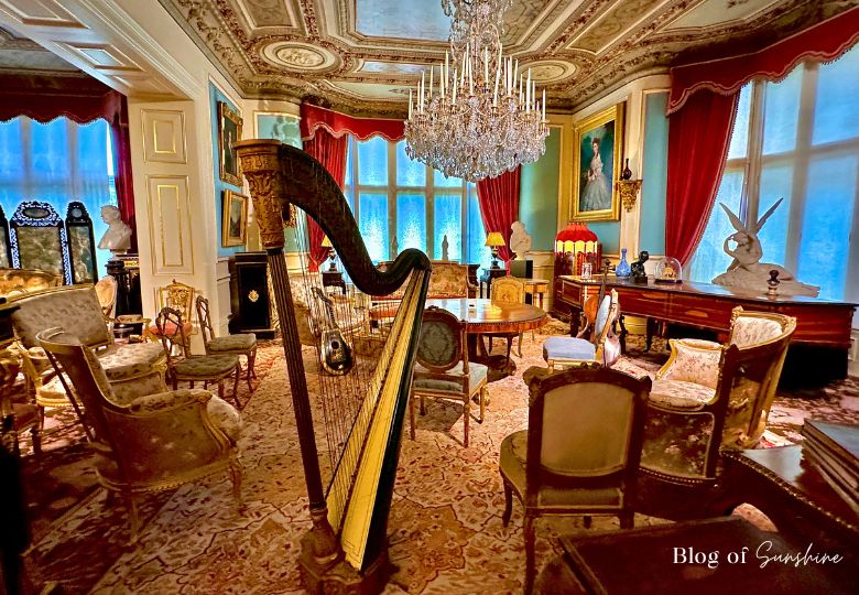 Victorian drawing room with harp and chandelier at Cliffe Castle Keighley