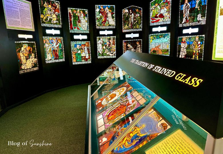 Stained glass panels and display cabinet in the stained glass room at Cliffe Castle Keighley