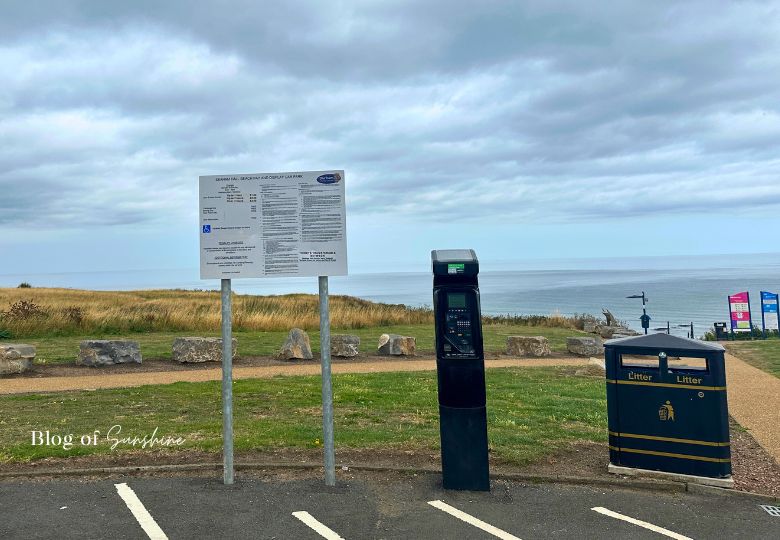 Pay and display parking meter and sign overlooking the sea at Seaham Hall Beach
