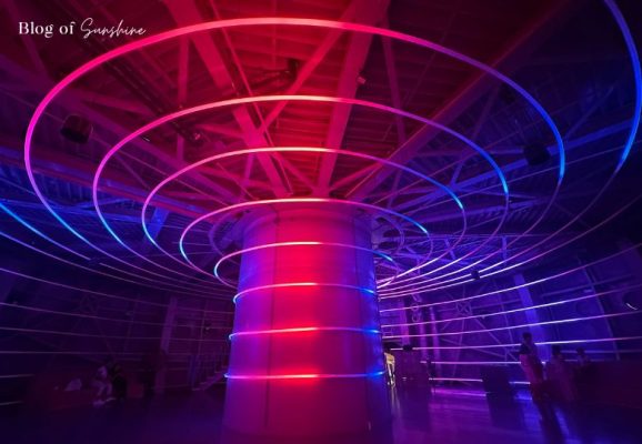 Colorful neon ring light installation inside the Atomium’s immersive sphere
