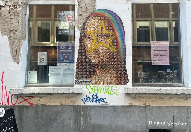 Photo-based rainbow street art mural on LGBTQ+ building in Brussels