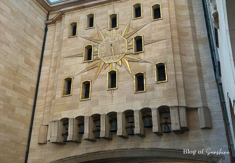 Close-up of figurines and golden clock face on the Mont des Arts carillon in Brussels