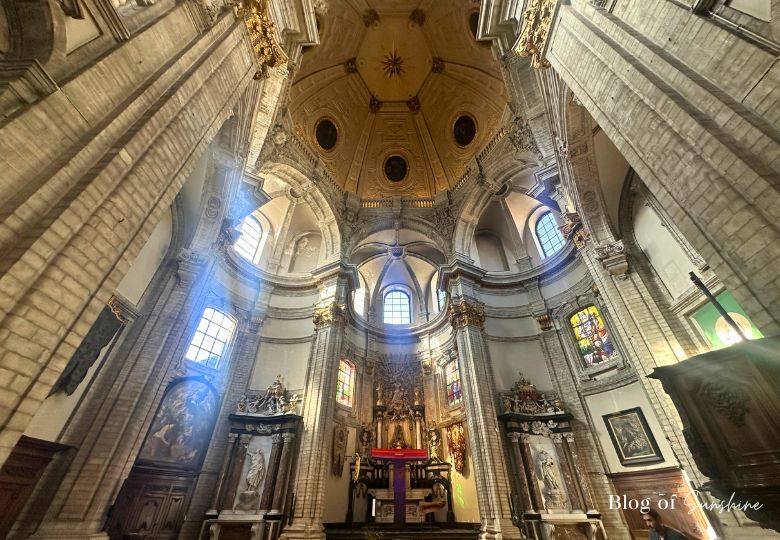 Interior of Église Notre‑Dame de Bon Secours in Brussels, showing baroque altar and dome