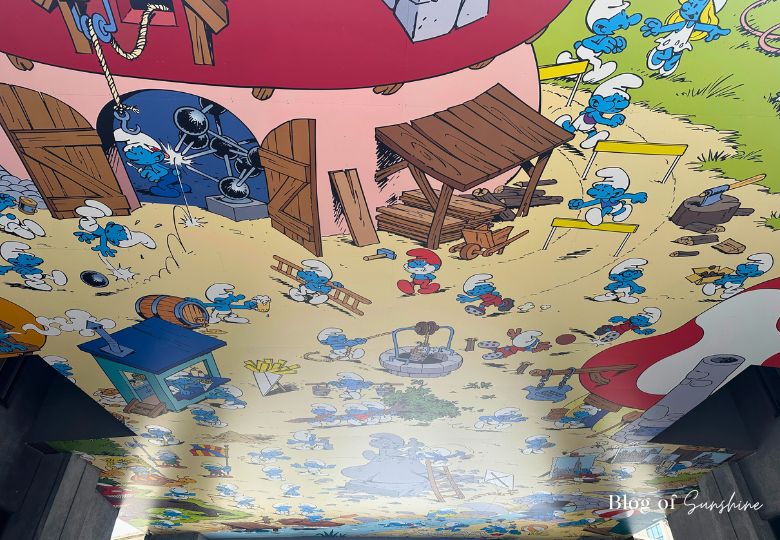 Colourful ceiling mural of The Smurfs in a Brussels passage