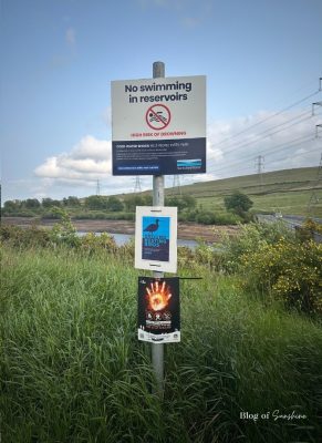 Yorkshire Water safety signs at Baitings Reservoir warning no swimming, protecting ground nesting birds and high fire risk