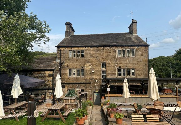 Back of The Malt House pub in Rishworth with outdoor seating and beer garden near Baitings Reservoir