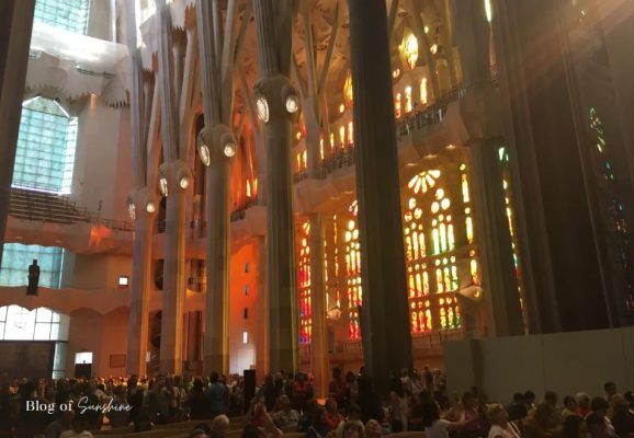 Warm afternoon stained-glass light filling the Passion side of the Sagrada Família