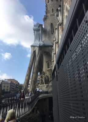 Visitors walking up the ramp to the Passion Facade of the Sagrada Família