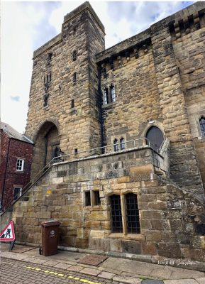 Stone medieval Moot Hall tower with steps leading up in Hexham town centre
