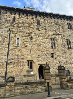 Stone exterior and arched doorway of Hexham Old Gaol, England’s oldest purpose-built prison