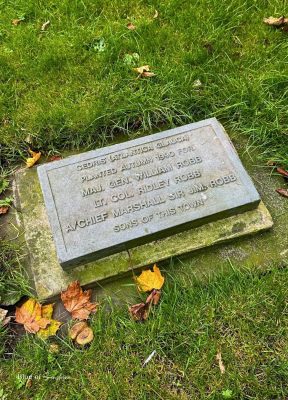 Memorial plaque in Hexham park marking a cedar tree planted for local Robb brothers