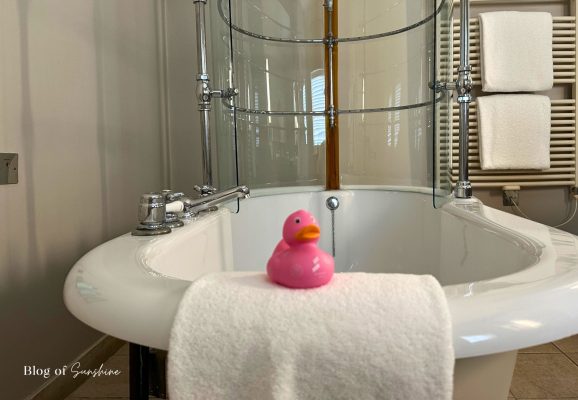 Rubber duck in the Seaham Hall Garden Suite bathroom on a towel by the bath
