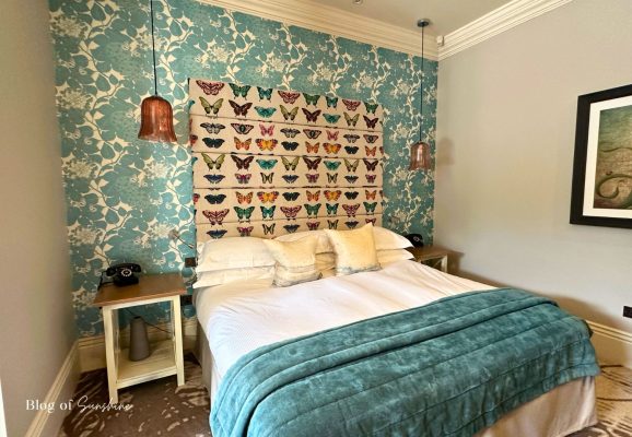 Bedroom in the Seaham Hall Garden Suite with Hot Tub showing the bed and feature wall
