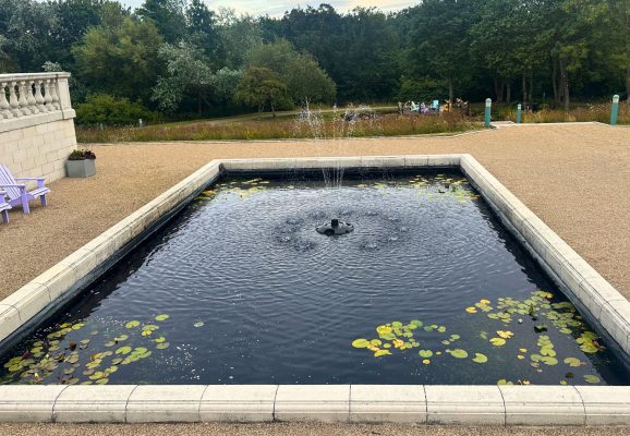 Seaham Hall Hotel terrace garden with fountain pond and outdoor seating in County Durham