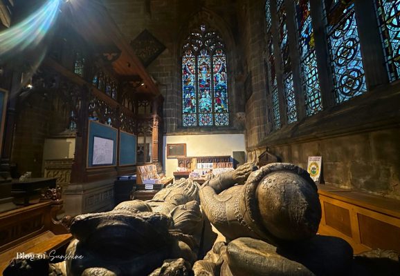 View along the de Bower tomb towards stained glass inside St John the Baptist Church Tideswell (Buxton)