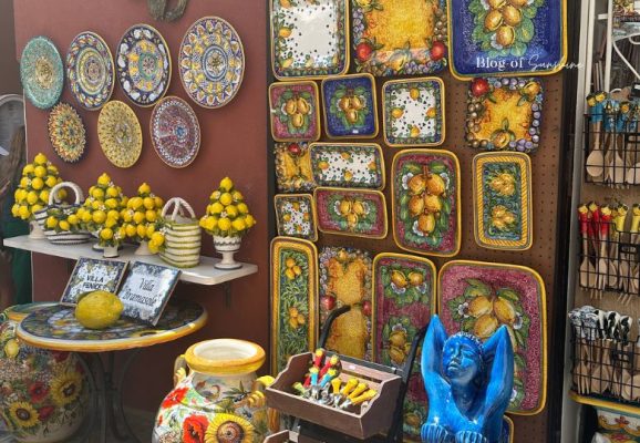 Colourful Amalfi Coast ceramics and lemon souvenirs displayed in a shop in Amalfi