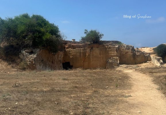 Burial Mound area at Tombs of the Kings in Paphos Cyprus with rocky paths and ancient tomb entrances