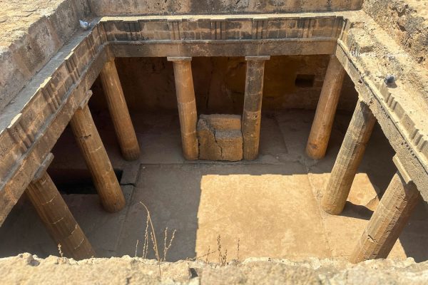 Ancient underground tomb with stone columns at Tombs of the Kings in Paphos, Cyprus