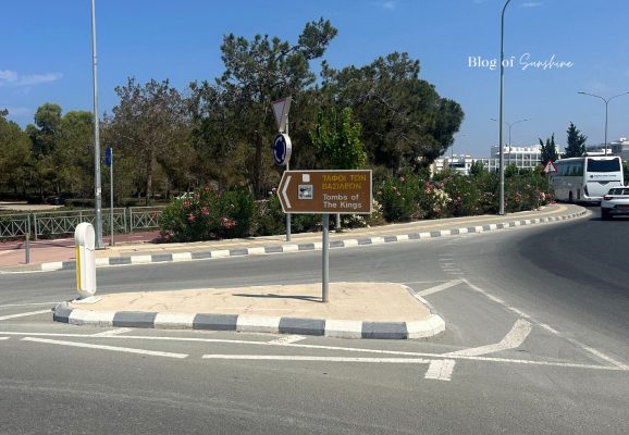 Road sign pointing to Tombs of the Kings in Paphos Cyprus near the entrance road