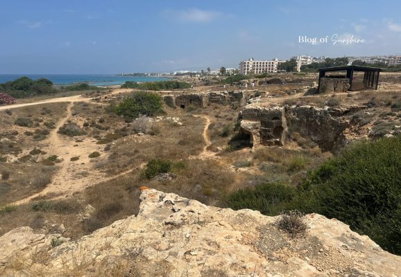 View across Tombs of the Kings in Paphos Cyprus with archaeological ruins and the sea in the background