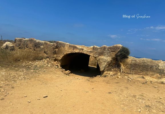 Small rock-cut tomb entrance near Tomb 2 at Tombs of the Kings in Paphos Cyprus