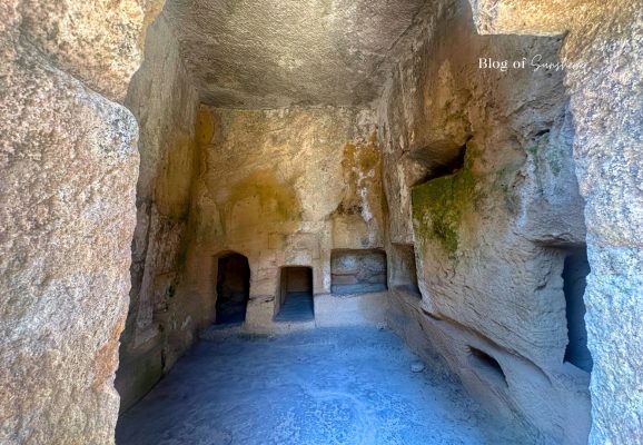Interior chamber of Tomb 1 at Tombs of the Kings in Paphos Cyprus with rock-cut burial niches