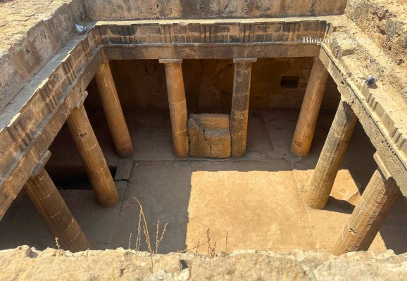 Underground courtyard with stone columns inside Tomb 3 at Tombs of the Kings in Paphos Cyprus
