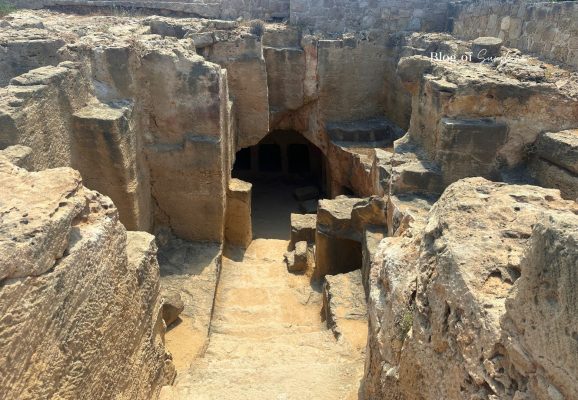 Stone steps leading down into Tomb 4 at Tombs of the Kings in Paphos Cyprus