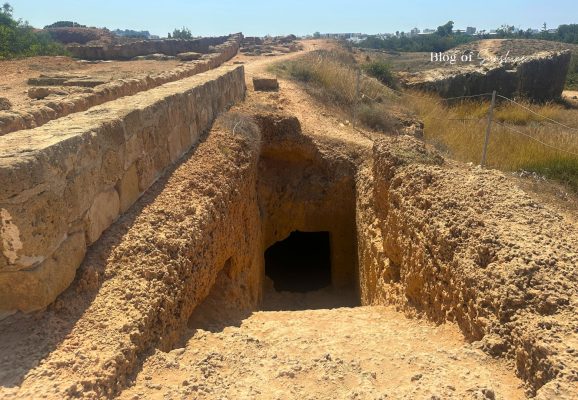 Steps leading down into an underground rock-cut tomb at Tombs of the Kings in Paphos Cyprus